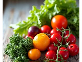 A colorful spread of fresh, organic vegetables and fruits laid out on a rustic wooden table, with sunlight illuminating them, representing nutritious meals.